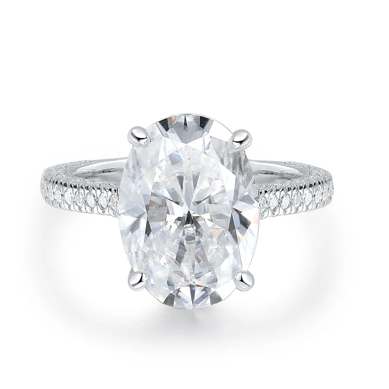 Diamond ring with a large central gemstone on a white background